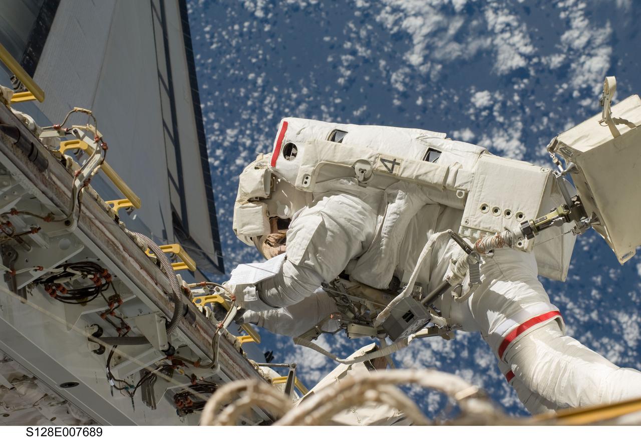S128-E-007689 (3 Sept. 2009) --- NASA astronaut John “Danny” Olivas, STS-128 mission specialist, participates in the mission's second session of extravehicular activity (EVA) as construction and maintenance continue on the International Space Station. During the six-hour, 39-minute spacewalk, Olivas and European Space Agency astronaut Christer Fuglesang (out of frame), mission specialist, installed the new Ammonia Tank Assembly on the Port 1 Truss and stowed the empty tank assembly into the Space Shuttle Discovery’s cargo bay.