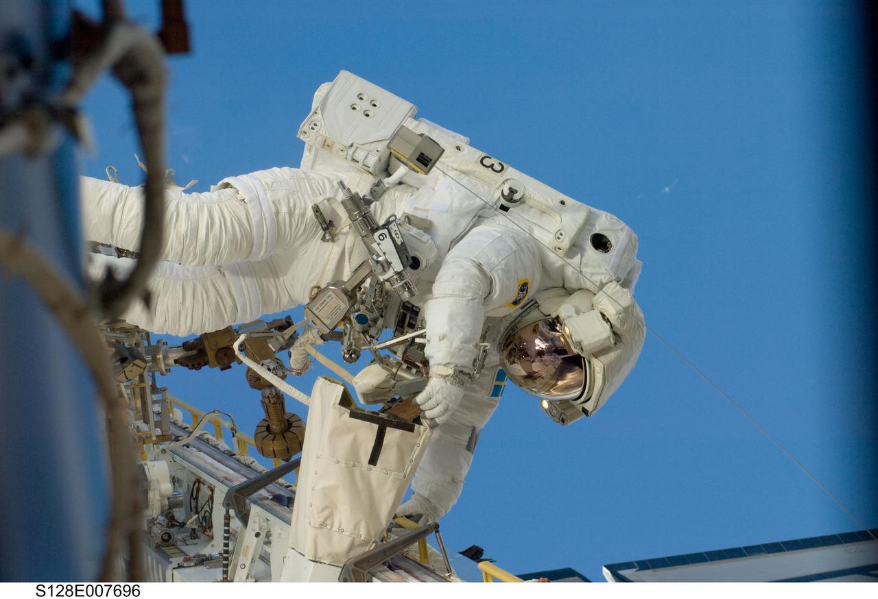 S128-E-007696 (3 Sept. 2009) --- European Space Agency astronaut Christer Fuglesang, STS-128 mission specialist, participates in the mission's second session of extravehicular activity (EVA) as construction and maintenance continue on the International Space Station. During the six-hour, 39-minute spacewalk, Fuglesang and NASA astronaut John “Danny” Olivas (out of frame), mission specialist, installed the new Ammonia Tank Assembly on the Port 1 Truss and stowed the empty tank assembly into the Space Shuttle Discovery’s cargo bay.