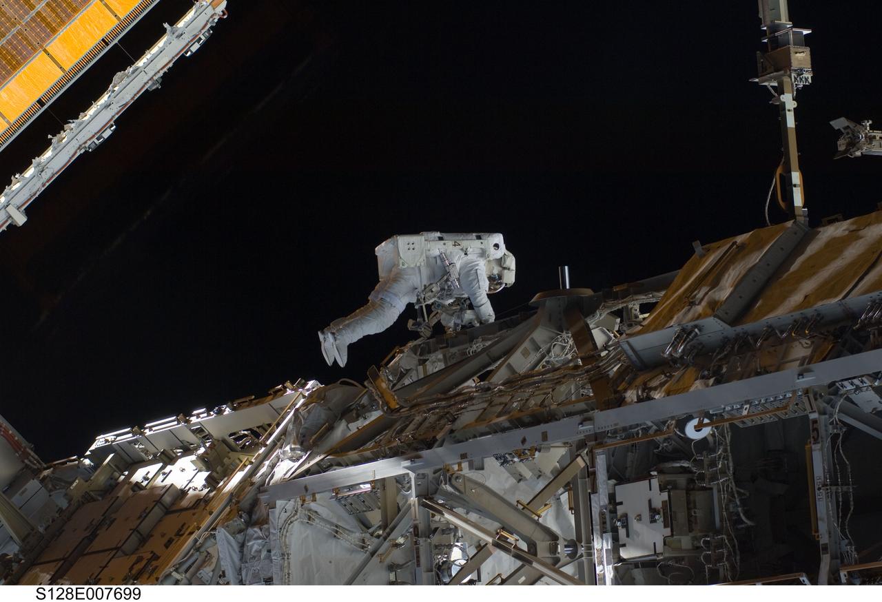 S128-E-007699 (5 Sept. 2009) --- European Space Agency astronaut Christer Fuglesang, STS-128 mission specialist, participates in the mission's third and final session of extravehicular activity (EVA) as construction and maintenance continue on the International Space Station. During the seven-hour, one-minute spacewalk, Fuglesang and NASA astronaut John “Danny” Olivas (out of frame), mission specialist, deployed the Payload Attachment System (PAS), replaced the Rate Gyro Assembly #2, installed two GPS antennae and did some work to prepare for the installation of Node 3 next year. During connection of one of two sets of avionics cables for Node 3, one of the connectors could not be mated. This cable and connector were wrapped in a protective sleeve and safed. All other cables were mated successfully.