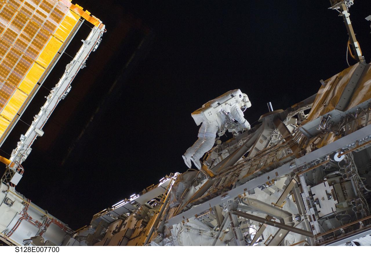 S128-E-007700 (5 Sept. 2009) --- European Space Agency astronaut Christer Fuglesang, STS-128 mission specialist, participates in the mission's third and final session of extravehicular activity (EVA) as construction and maintenance continue on the International Space Station. During the seven-hour, one-minute spacewalk, Fuglesang and NASA astronaut John “Danny” Olivas (out of frame), mission specialist, deployed the Payload Attachment System (PAS), replaced the Rate Gyro Assembly #2, installed two GPS antennae and did some work to prepare for the installation of Node 3 next year. During connection of one of two sets of avionics cables for Node 3, one of the connectors could not be mated. This cable and connector were wrapped in a protective sleeve and safed. All other cables were mated successfully.