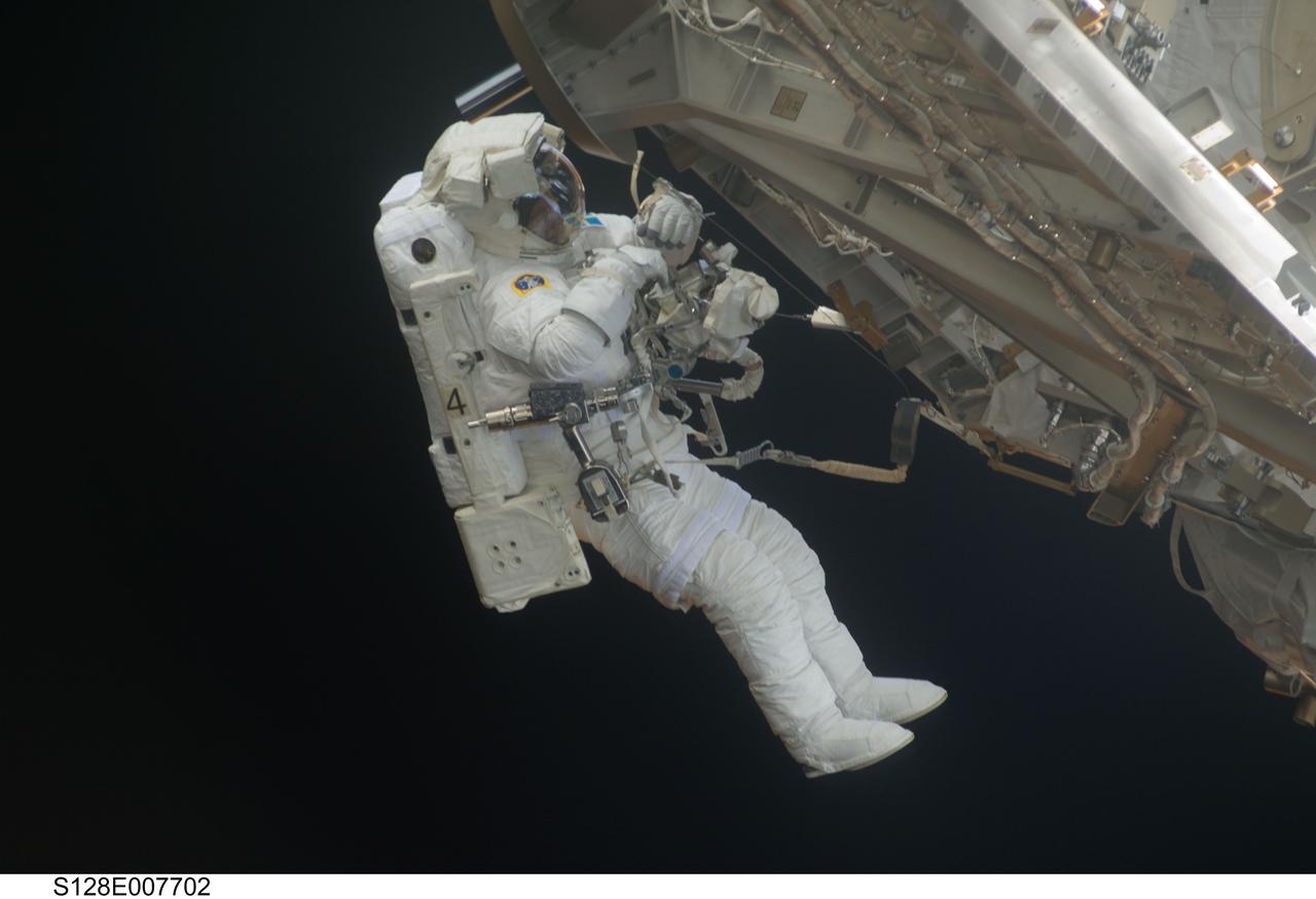 S128-E-007702 (5 Sept. 2009) --- European Space Agency astronaut Christer Fuglesang, STS-128 mission specialist, participates in the mission's third and final session of extravehicular activity (EVA) as construction and maintenance continue on the International Space Station. During the seven-hour, one-minute spacewalk, Fuglesang and NASA astronaut John “Danny” Olivas (out of frame), mission specialist, deployed the Payload Attachment System (PAS), replaced the Rate Gyro Assembly #2, installed two GPS antennae and did some work to prepare for the installation of Node 3 next year. During connection of one of two sets of avionics cables for Node 3, one of the connectors could not be mated. This cable and connector were wrapped in a protective sleeve and safed. All other cables were mated successfully.
