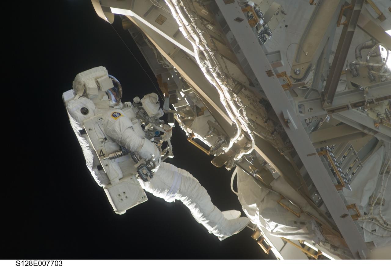S128-E-007703 (5 Sept. 2009) --- European Space Agency astronaut Christer Fuglesang, STS-128 mission specialist, participates in the mission's third and final session of extravehicular activity (EVA) as construction and maintenance continue on the International Space Station. During the seven-hour, one-minute spacewalk, Fuglesang and NASA astronaut John “Danny” Olivas (out of frame), mission specialist, deployed the Payload Attachment System (PAS), replaced the Rate Gyro Assembly #2, installed two GPS antennae and did some work to prepare for the installation of Node 3 next year. During connection of one of two sets of avionics cables for Node 3, one of the connectors could not be mated. This cable and connector were wrapped in a protective sleeve and safed. All other cables were mated successfully.
