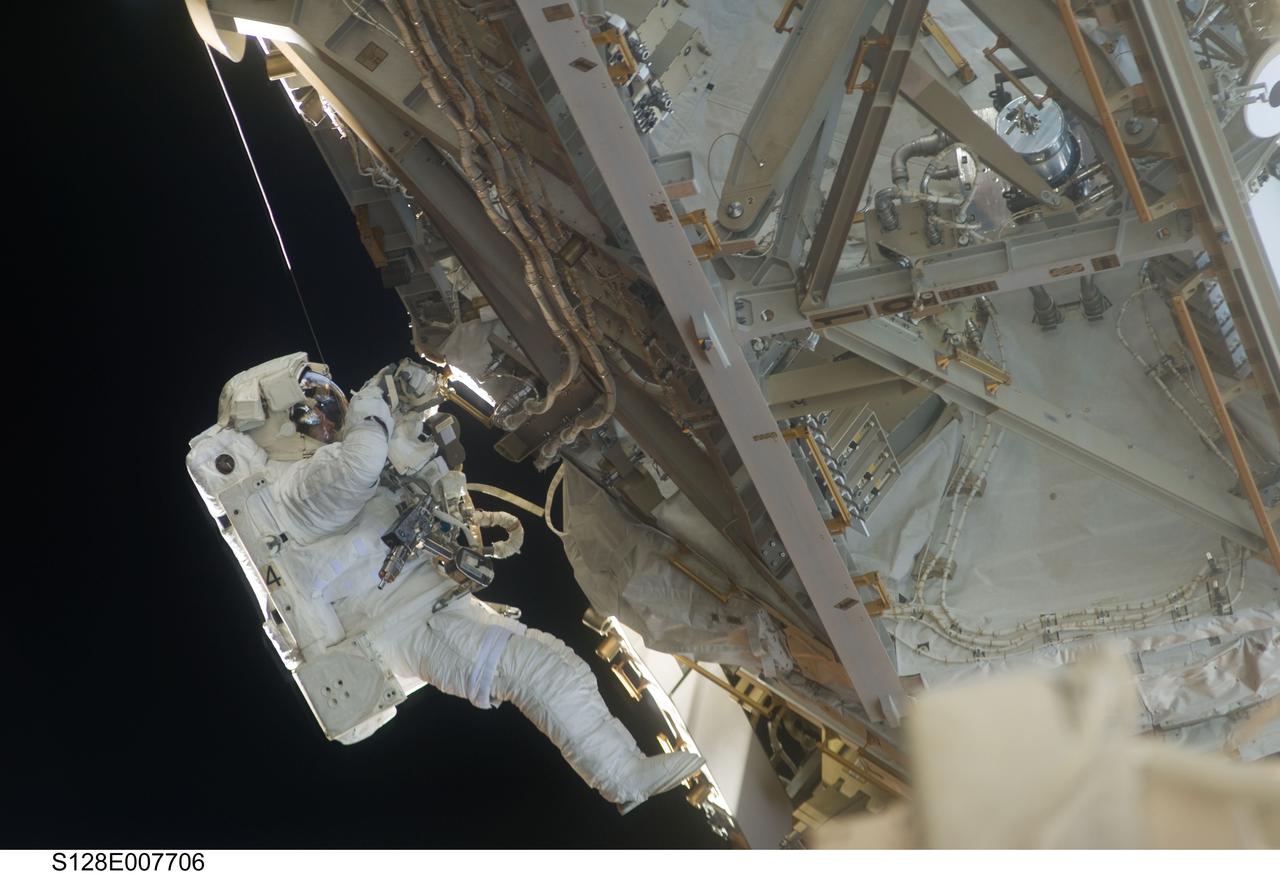 S128-E-007706 (5 Sept. 2009) --- European Space Agency astronaut Christer Fuglesang, STS-128 mission specialist, participates in the mission's third and final session of extravehicular activity (EVA) as construction and maintenance continue on the International Space Station. During the seven-hour, one-minute spacewalk, Fuglesang and NASA astronaut John “Danny” Olivas (out of frame), mission specialist, deployed the Payload Attachment System (PAS), replaced the Rate Gyro Assembly #2, installed two GPS antennae and did some work to prepare for the installation of Node 3 next year. During connection of one of two sets of avionics cables for Node 3, one of the connectors could not be mated. This cable and connector were wrapped in a protective sleeve and safed. All other cables were mated successfully.