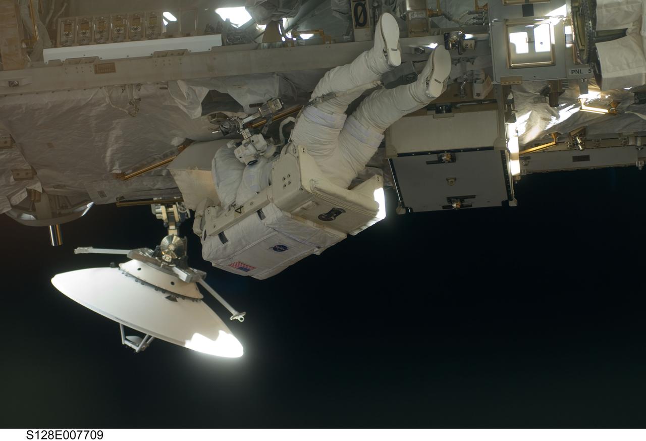 S128-E-007709 (5 Sept. 2009) --- European Space Agency astronaut Christer Fuglesang, STS-128 mission specialist, participates in the mission's third and final session of extravehicular activity (EVA) as construction and maintenance continue on the International Space Station. During the seven-hour, one-minute spacewalk, Fuglesang and NASA astronaut John “Danny” Olivas (out of frame), mission specialist, deployed the Payload Attachment System (PAS), replaced the Rate Gyro Assembly #2, installed two GPS antennae and did some work to prepare for the installation of Node 3 next year. During connection of one of two sets of avionics cables for Node 3, one of the connectors could not be mated. This cable and connector were wrapped in a protective sleeve and safed. All other cables were mated successfully.