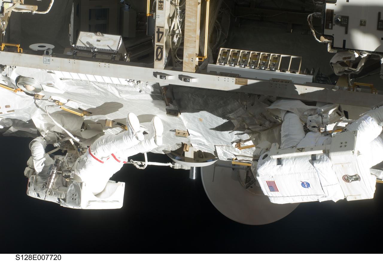 S128-E-007720 (5 Sept. 2009) --- NASA astronaut John “Danny” Olivas (left) and European Space Agency astronaut Christer Fuglesang, both STS-128 mission specialists, participate in the mission's third and final session of extravehicular activity (EVA) as construction and maintenance continue on the International Space Station. During the seven-hour, one-minute spacewalk, Olivas and Fuglesang deployed the Payload Attachment System (PAS), replaced the Rate Gyro Assembly #2, installed two GPS antennae and did some work to prepare for the installation of Node 3 next year. During connection of one of two sets of avionics cables for Node 3, one of the connectors could not be mated. This cable and connector were wrapped in a protective sleeve and safed. All other cables were mated successfully.