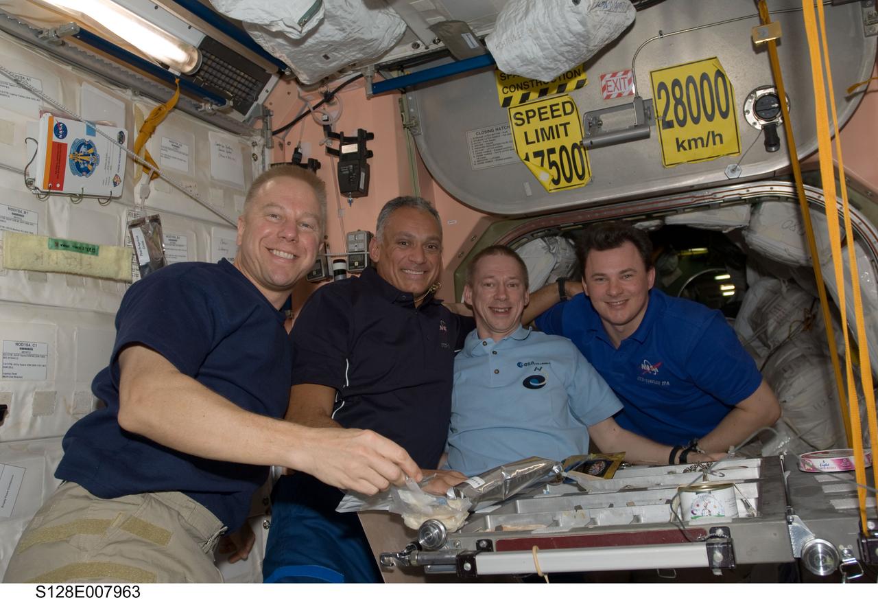 S128-E-007963 (7 Sept. 2009) --- NASA astronauts Tim Kopra (left) and John “Danny” Olivas, both STS-128 mission specialists; along with European Space Agency astronaut Frank De Winne and Russian cosmonaut Roman Romanenko, both Expedition 20 flight engineers, pose for a photo in the Unity node of the International Space Station while Space Shuttle Discovery remains docked with the station.