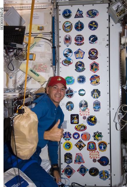 NASA image: Crew poses at patch wall in Node 1