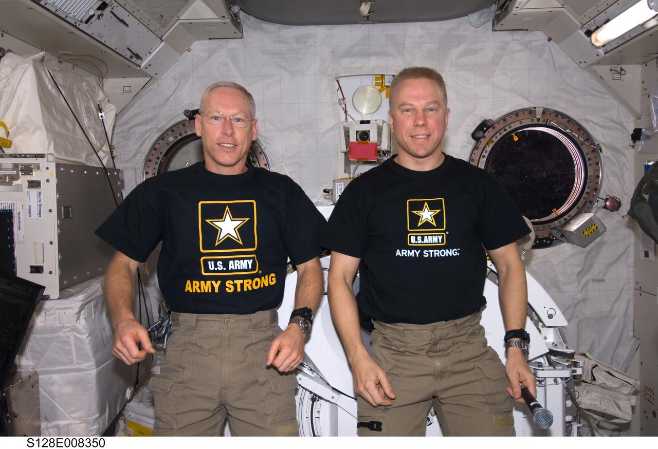S128-E-008350 (7 Sept. 2009) --- NASA astronauts Patrick Forrester (left) and Tim Kopra, both STS-128 mission specialists, pose for a photo in the Kibo laboratory of the International Space Station while Space Shuttle Discovery remains docked with the station.