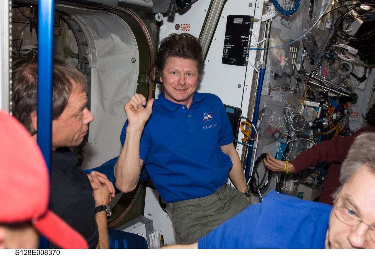 S128-E-008370 (7 Sept. 2009) --- Russian cosmonaut Gennady Padalka (center), Expedition 20 commander; European Space Agency astronaut Christer Fuglesang (left), STS-128 mission specialist; and Canadian Space Agency astronaut Robert Thirsk, Expedition 20 flight engineer, are pictured on the International Space Station while Space Shuttle Discovery remains docked with the station.