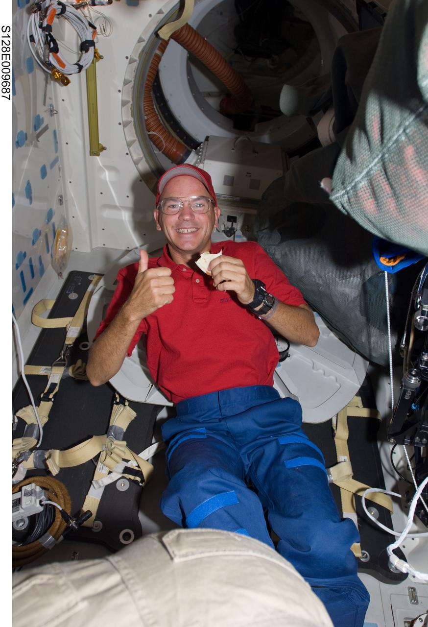 S128-E-009687 (8 Sept. 2009) --- NASA astronaut Rick Sturckow, STS-128 commander, gives a “thumbs-up” signal on the middeck of Space Shuttle Discovery during flight day 12 activities.