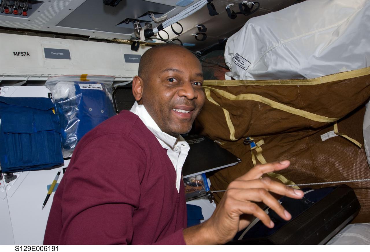 S129-E-006191 (17 Nov. 2009) --- Astronaut Robert L. Satcher Jr., STS-129 mission specialist, works on the middeck of Space Shuttle Atlantis during flight day two activities.