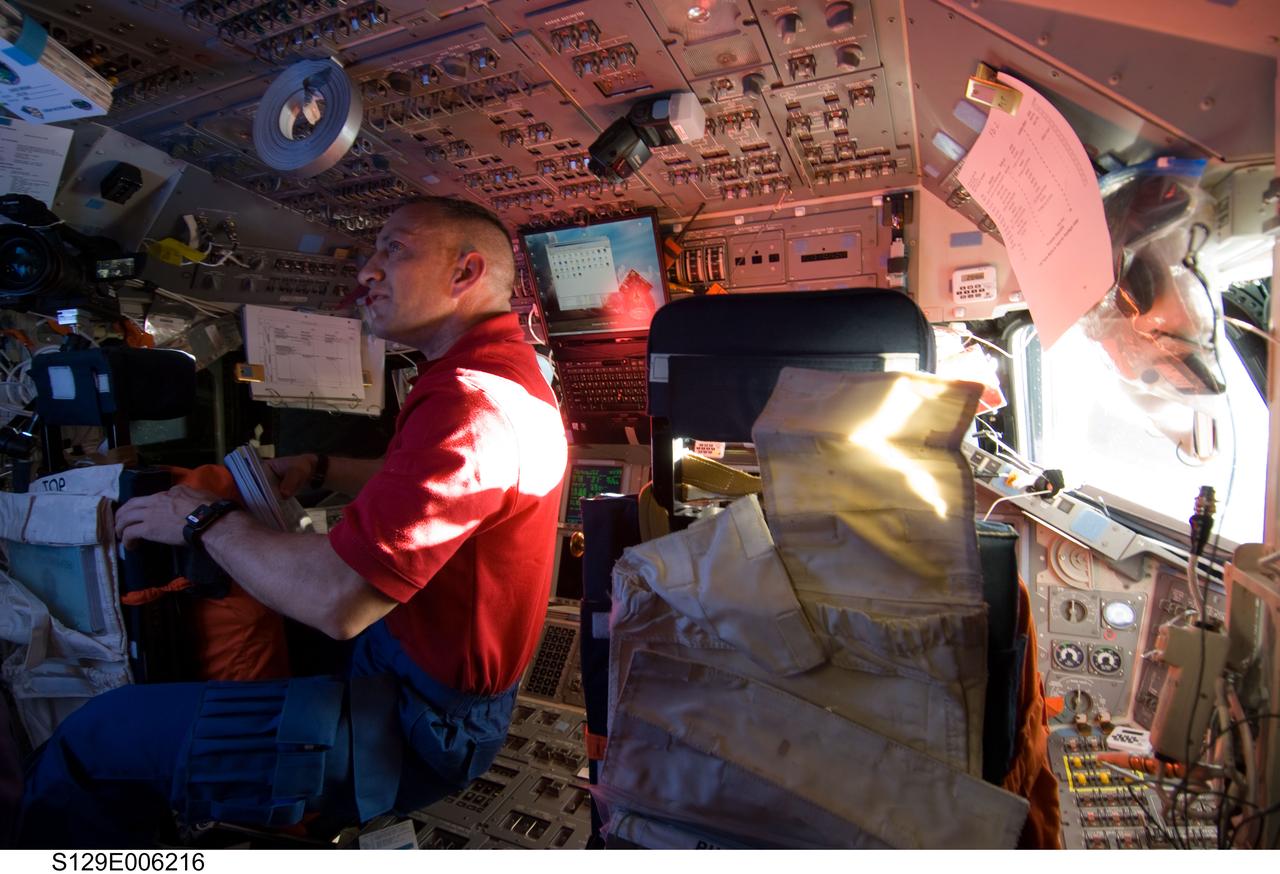 S129-E-006216 (17 Nov. 2009) --- Astronaut Charles O. Hobaugh, STS-129 commander, is pictured on the flight deck of Space Shuttle Atlantis during flight day two activities.