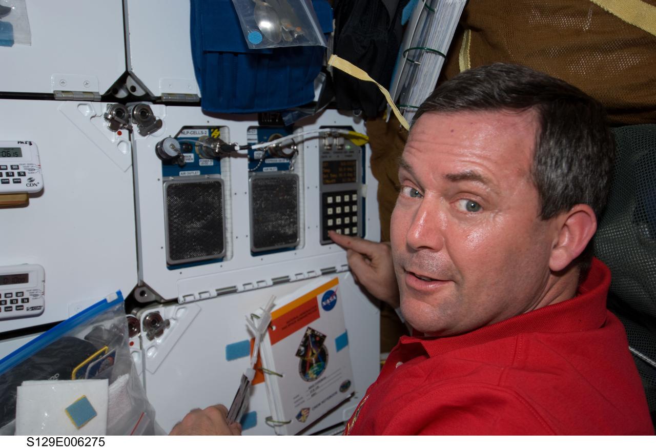 S129-E-006275 (17 Nov. 2009) --- Astronaut Mike Foreman, STS-129 mission specialist, is pictured on the middeck of Space Shuttle Atlantis during flight day two activities.