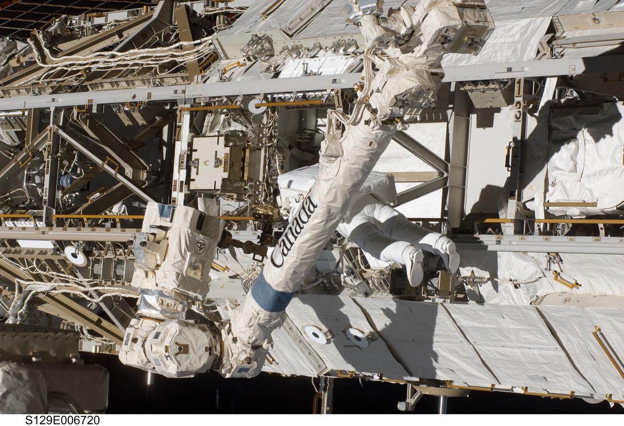 S129-E-006720 (19 Nov. 2009) --- Astronaut Robert L. Satcher Jr., STS-129 mission specialist, participates in the mission's first session of extravehicular activity (EVA) as construction and maintenance continue on the International Space Station. During the six-hour, 37-minute spacewalk, Satcher and astronaut Mike Foreman (out of frame), mission specialist, installed a spare S-band antenna structural assembly to the Z1 segment of the station?s truss, or backbone. Foreman and Satcher also installed a set of cables for a future space-to-ground antenna on the Destiny laboratory and replaced a handrail on the Unity node with a new bracket used to route an ammonia cable that will be needed for the Tranquility node when it is delivered next year. The two spacewalkers also repositioned a cable connector on Unity, checked S0 truss cable connections, and lubricated latching snares on the Kibo robotic arm and the station?s mobile base system.