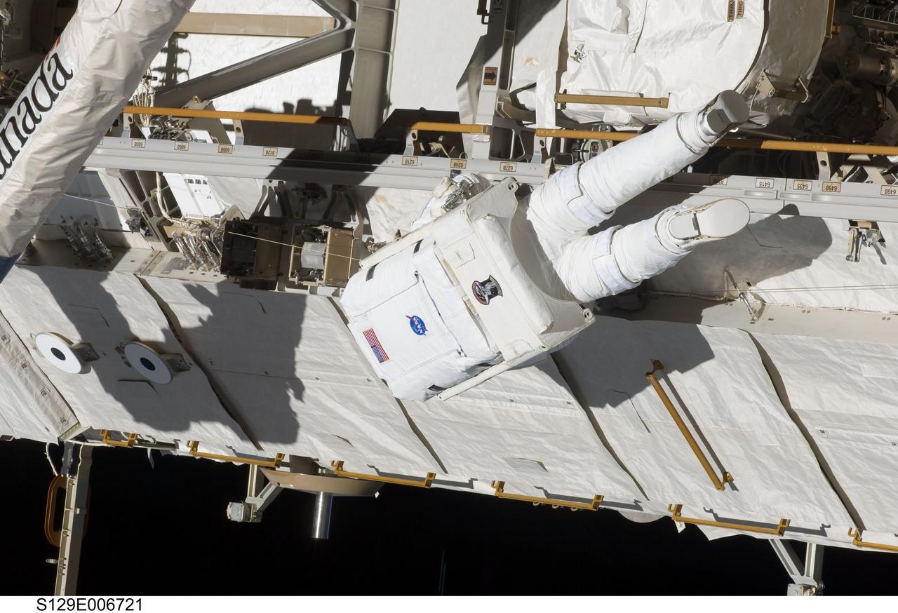 S129-E-006721 (19 Nov. 2009) --- Astronaut Robert L. Satcher Jr., STS-129 mission specialist, participates in the mission's first session of extravehicular activity (EVA) as construction and maintenance continue on the International Space Station. During the six-hour, 37-minute spacewalk, Satcher and astronaut Mike Foreman (out of frame), mission specialist, installed a spare S-band antenna structural assembly to the Z1 segment of the station?s truss, or backbone. Foreman and Satcher also installed a set of cables for a future space-to-ground antenna on the Destiny laboratory and replaced a handrail on the Unity node with a new bracket used to route an ammonia cable that will be needed for the Tranquility node when it is delivered next year. The two spacewalkers also repositioned a cable connector on Unity, checked S0 truss cable connections, and lubricated latching snares on the Kibo robotic arm and the station?s mobile base system.