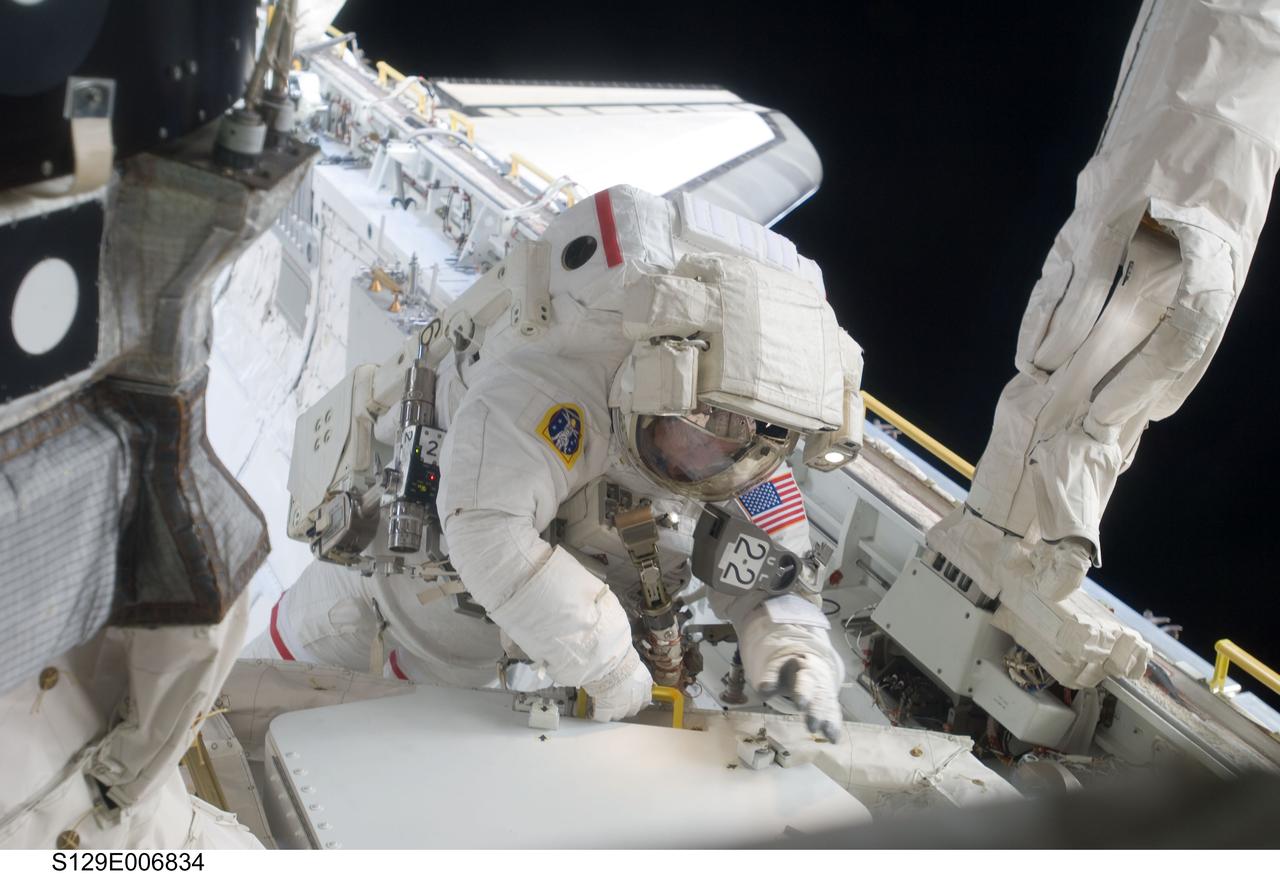 S129-E-006834 (19 Nov. 2009) --- Astronaut Mike Foreman, STS-129 mission specialist, participates in the mission's first session of extravehicular activity (EVA) as construction and maintenance continue on the International Space Station. During the six-hour, 37-minute spacewalk, Foreman and astronaut Robert L. Satcher Jr. (out of frame), mission specialist, installed a spare S-band antenna structural assembly to the Z1 segment of the station?s truss, or backbone. Foreman and Satcher also installed a set of cables for a future space-to-ground antenna on the Destiny laboratory and replaced a handrail on the Unity node with a new bracket used to route an ammonia cable that will be needed for the Tranquility node when it is delivered next year. The two spacewalkers also repositioned a cable connector on Unity, checked S0 truss cable connections, and lubricated latching snares on the Kibo robotic arm and the station?s mobile base system.