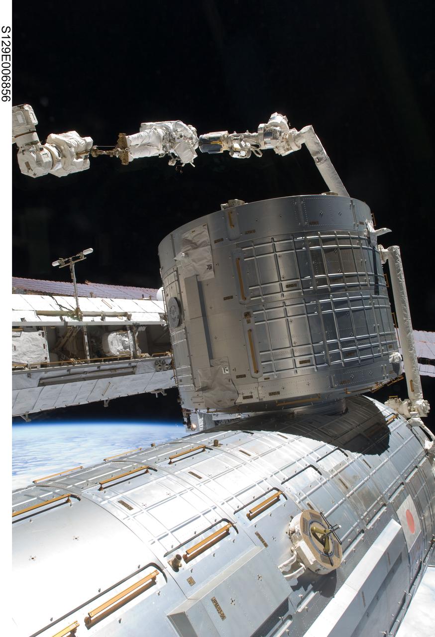 S129-E-006856 (19 Nov. 2009) --- Anchored to a Canadarm2 mobile foot restraint, astronaut Robert L. Satcher Jr., STS-129 mission specialist, participates in the mission's first session of extravehicular activity (EVA) as construction and maintenance continue on the International Space Station. During the six-hour, 37-minute spacewalk, Satcher and astronaut Mike Foreman (out of frame), mission specialist, installed a spare S-band antenna structural assembly to the Z1 segment of the station?s truss, or backbone. Foreman and Satcher also installed a set of cables for a future space-to-ground antenna on the Destiny laboratory and replaced a handrail on the Unity node with a new bracket used to route an ammonia cable that will be needed for the Tranquility node when it is delivered next year. The two spacewalkers also repositioned a cable connector on Unity, checked S0 truss cable connections, and lubricated latching snares on the Kibo robotic arm and the station?s mobile base system.