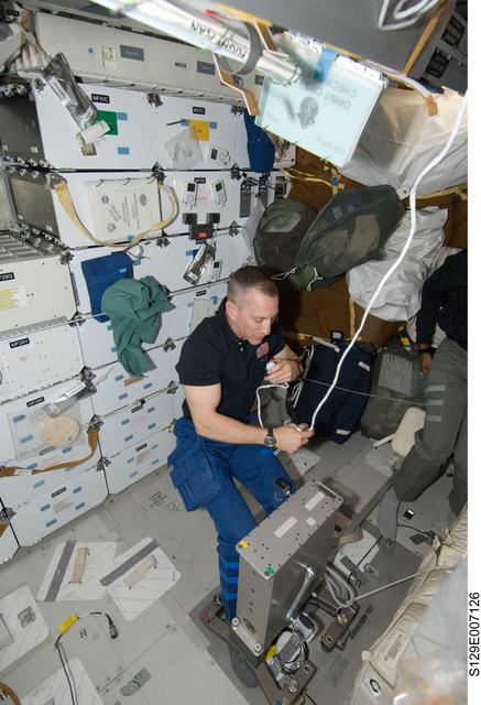 STS-129 CDT Hobaugh works on the Middeck