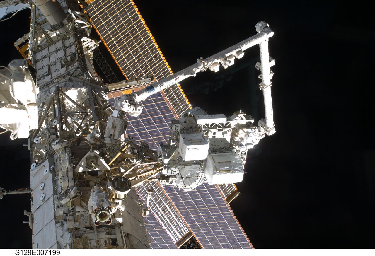 S129-E-007199  (21 Nov. 2009)  ---- The Canadarm2 or the  Space Station Remote Manipulator System mates the Express Logistics Carrier (ELC) 2 to the Zenith / Outboard Payload Attachment System (PAS) on the S3 Truss aboard the International Space Station, as controlled by Atlantis and station crews in the shirt sleeve environment of the orbital outpost.