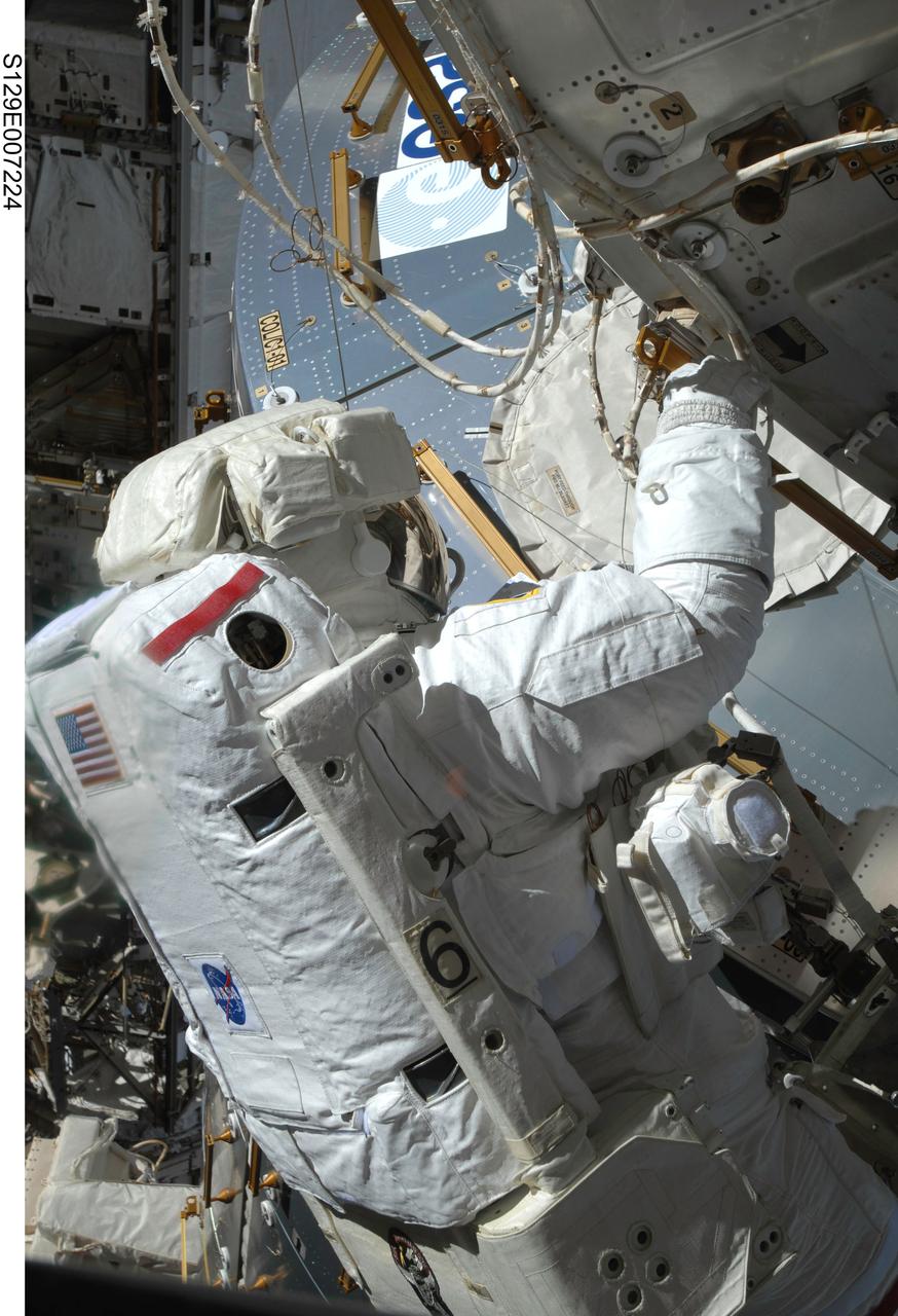 S129-E-007224 (21 Nov. 2009) --- Astronaut Mike Foreman, STS-129 mission specialist, performs a task near the European Space Agency’s Columbus module on the International Space Station during the second space walk of  Atlantis’ visit to the orbital outpost.
