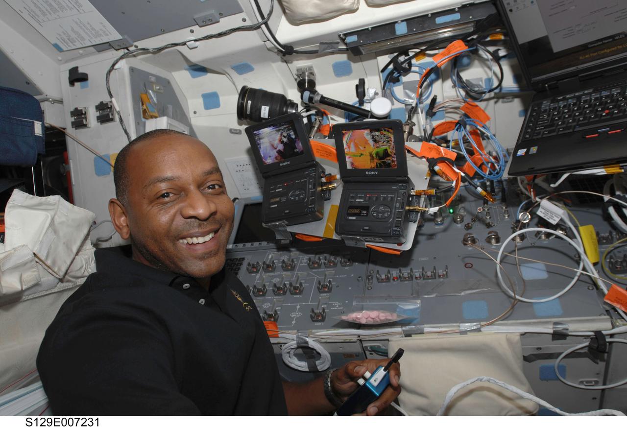 S129-E-007231 (21 Nov. 2009) --- Astronaut Robert L. Satcher Jr., STS-129 mission specialist, appears to be enjoying his duties on the flight deck of the space shuttle Atlantis during the mission’s second spacewalk. This time around, Satcher sees the activity from inside the shuttle and the International Space Station, while his assignment two days earlier had him participating outside in the extravehicular activities. Today, Satcher was one of the ten crew members remaining onboard during the EVA who gave support to astronauts Mike Foreman and Randy Bresnik, STS-129 mission specialists.