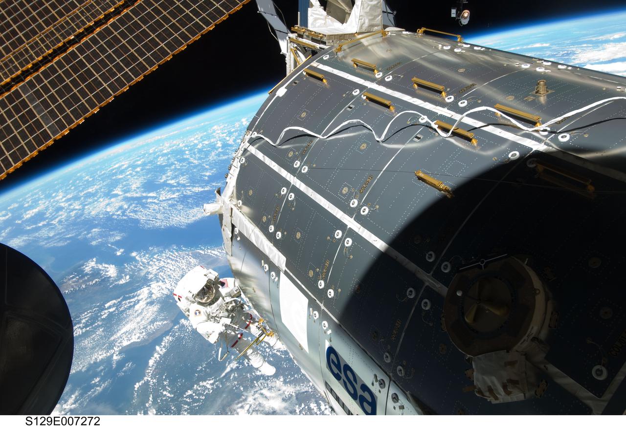 s129e007272 (November 21, 2017) --- Astronaut Randy Bresnik works outside the space station’s Columbus laboratory module during a spacewalk in November 2009. Bresnik last visited the station aboard space shuttle Atlantis during the STS-129 mission.