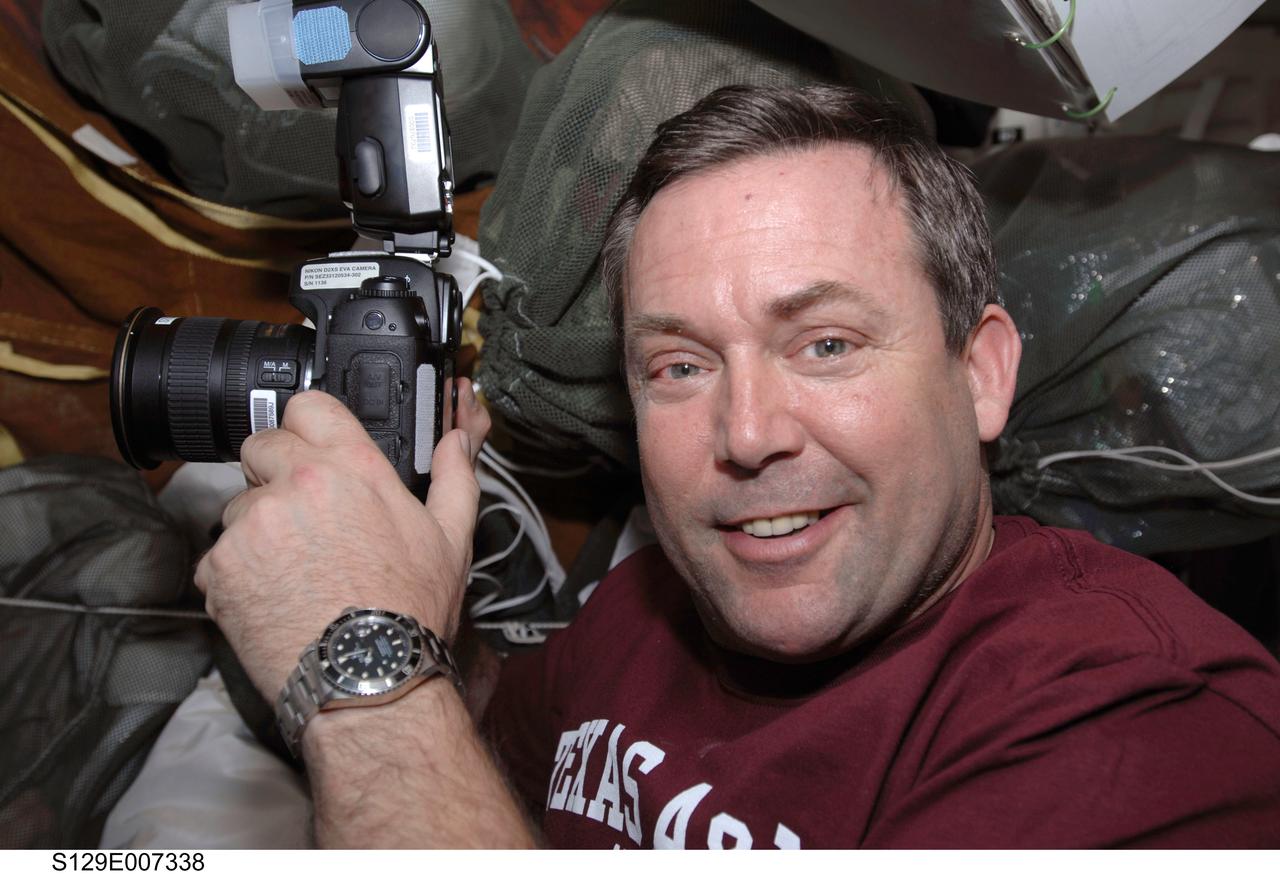 S129-E-007338 (22 Nov. 2009) --- Astronaut Mike Foreman, STS-129 mission specialist, takes pictures with an electronic still camera on a day of minimal mission assignments for the shuttle crew in between two days of busy spacewalks for the crews of the International Space Station and Atlantis.