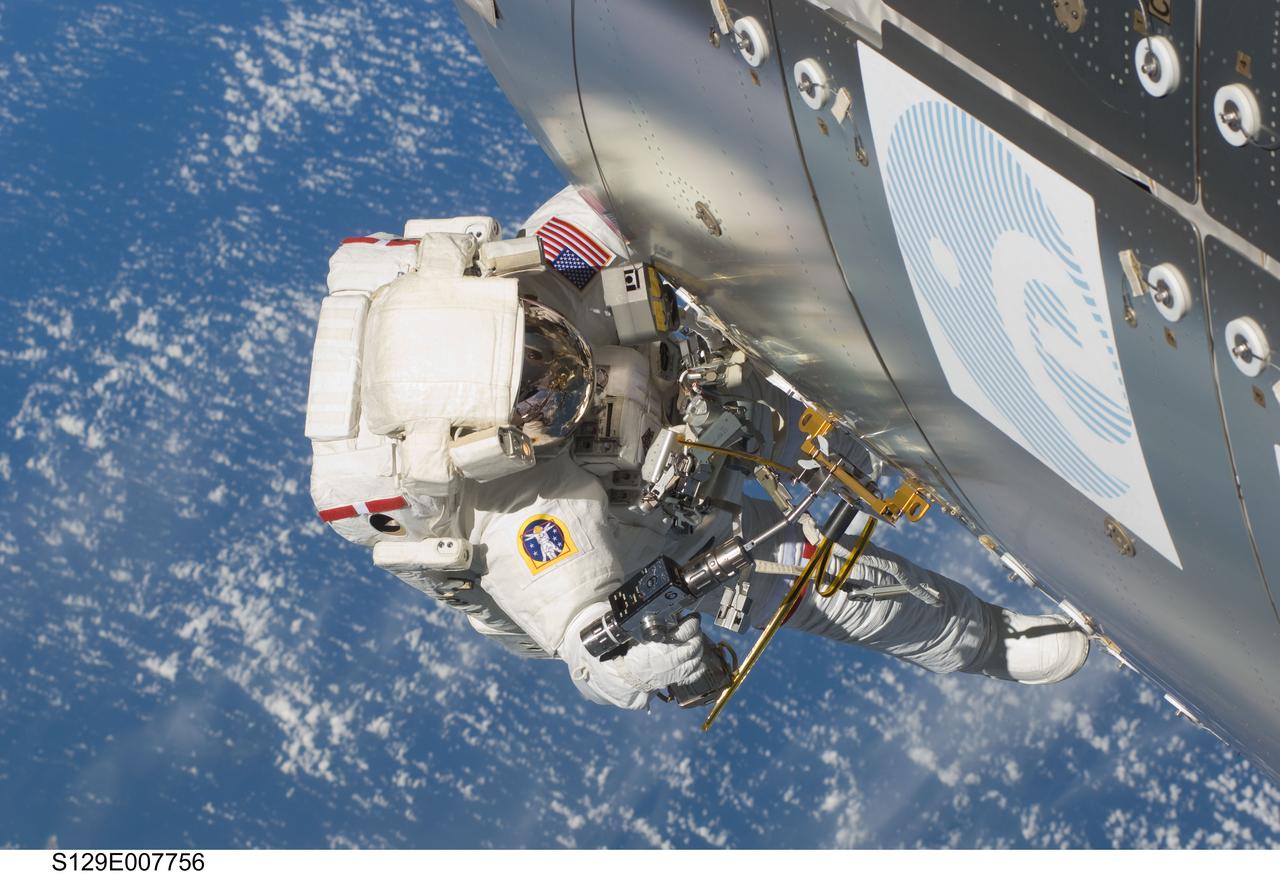 S129-E-007756 (21 Nov. 2009) --- Astronaut Randy Bresnik (near the Columbus laboratory), STS-129 mission specialist, participates in the mission's second session of extravehicular activity (EVA) as construction and maintenance continue on the International Space Station. During the six-hour, eight-minute spacewalk, Bresnik and astronaut Mike Foreman (out of frame), mission specialist, installed a Grappling Adaptor to On-Orbit Railing Assembly, or GATOR, on the Columbus laboratory. GATOR contains a ship-tracking antenna system and a HAM radio antenna. They relocated a floating potential measurement unit that gauges electric charges that build up on the station, deployed a Payload Attach System on the space-facing side of the Starboard 3 truss segment and installed a wireless video system that allows spacewalkers to transmit video to the station and relay it to Earth.