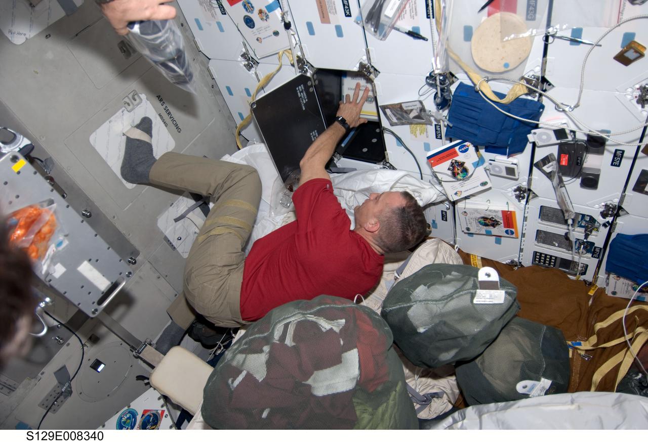 S129-E-008340 (24 Nov. 2009) --- Astronaut Charles O. Hobaugh, STS-129 commander, is pictured on the middeck of space shuttle Atlantis during flight day nine activities.