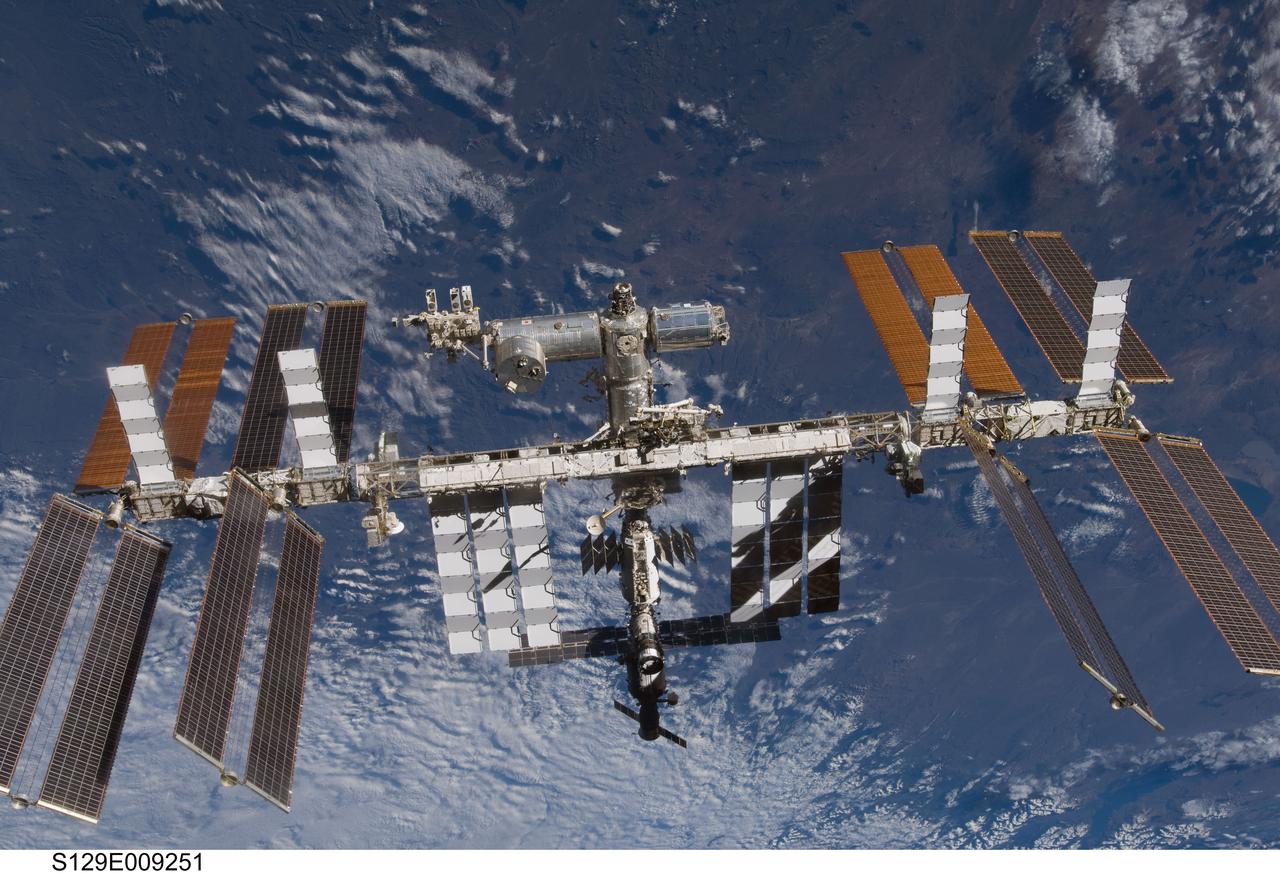 S129-E-009251 (25 Nov. 2009) --- The International Space Station is featured in this image photographed by an STS-129 crew member on Atlantis soon after the station and shuttle began their post-undocking relative separation. Undocking of the two spacecraft occurred at 3:53 a.m. (CST) on Nov. 25, 2009.