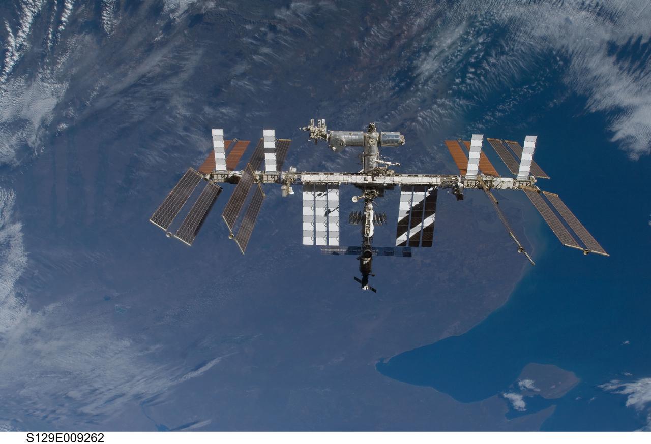 S129-E-009262 (25 Nov. 2009) --- This is one of a series of images featuring the International Space Station photographed soon after the space shuttle Atlantis and the station began their post-undocking relative separation. Undocking of the two spacecraft occurred at 3:53 a.m. (CST) on Nov. 25, 2009. Some scenes in the series show parts of the Mediterranean Sea and Africa and Spain in the background.