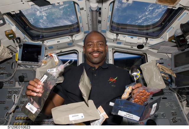 NASA image: View of MS Melvin posing for a photo on the Flight Deck