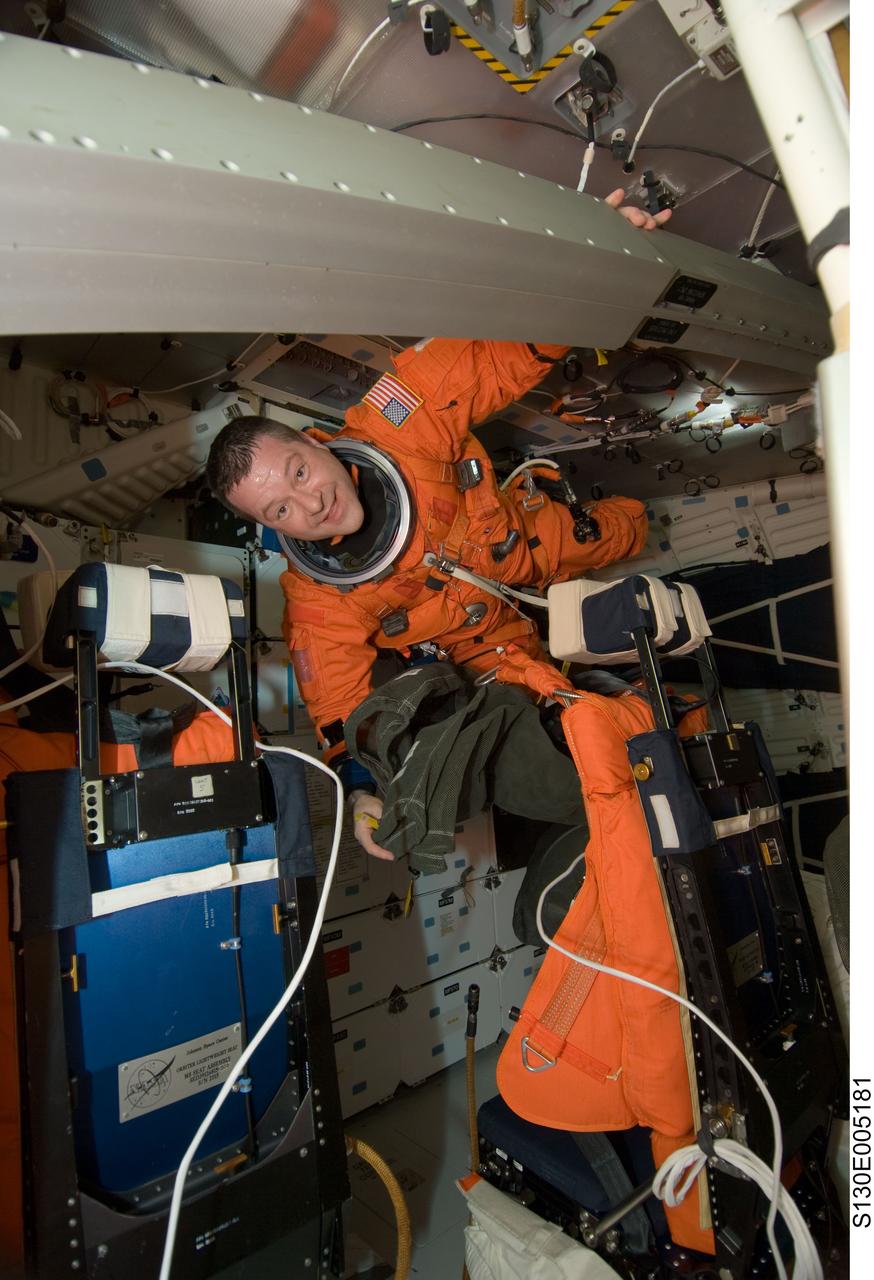S130-E-005181 (8 Feb. 2010) --- NASA astronaut Nicholas Patrick, STS-130 mission specialist, attired in his shuttle launch and entry suit, is pictured on the middeck of space shuttle Endeavour during postlaunch activities.