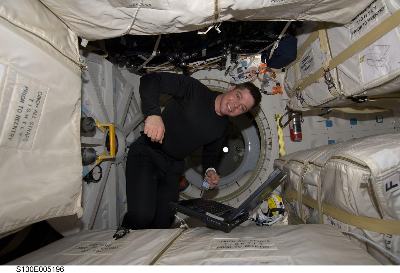 S130-E-005196 (8 Feb. 2010) --- NASA astronaut Robert Behnken, STS-130 mission specialist, is pictured on the middeck of space shuttle Endeavour during flight day one activities.