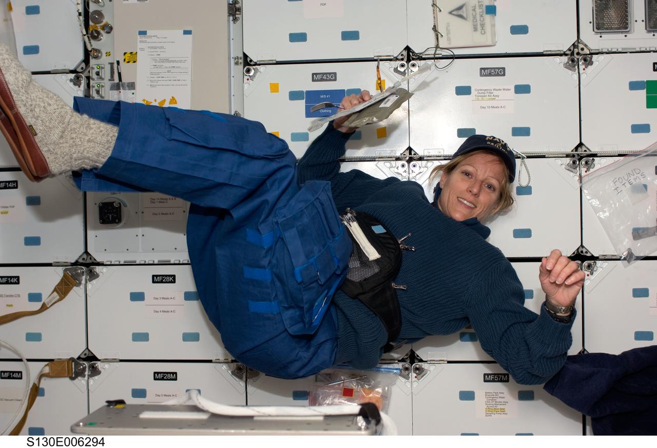S130-E-006294 (9 Feb. 2010)  --- Astronaut Kathryn Hire, STS-130 mission specialist, floats on the middeck of the Earth-orbiting space shuttle Endeavour during the early hours of flight day two.