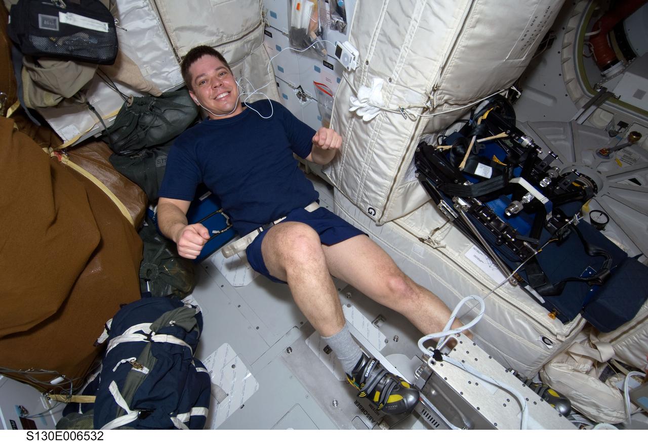 S130-E-006532 (9 Feb. 2010) --- NASA astronaut Robert Behnken, STS-130 mission specialist, exercises on a bicycle ergometer on the middeck of space shuttle Endeavour during flight day two activities.