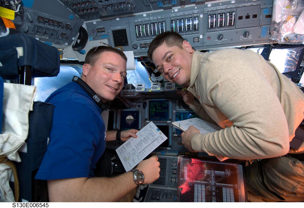 S130-E-006545 (9 Feb. 2010) --- NASA astronauts Terry Virts (left), STS-130 pilot; and Robert Behnken, mission specialist, are pictured on the flight deck of space shuttle Endeavour during flight day two activities.