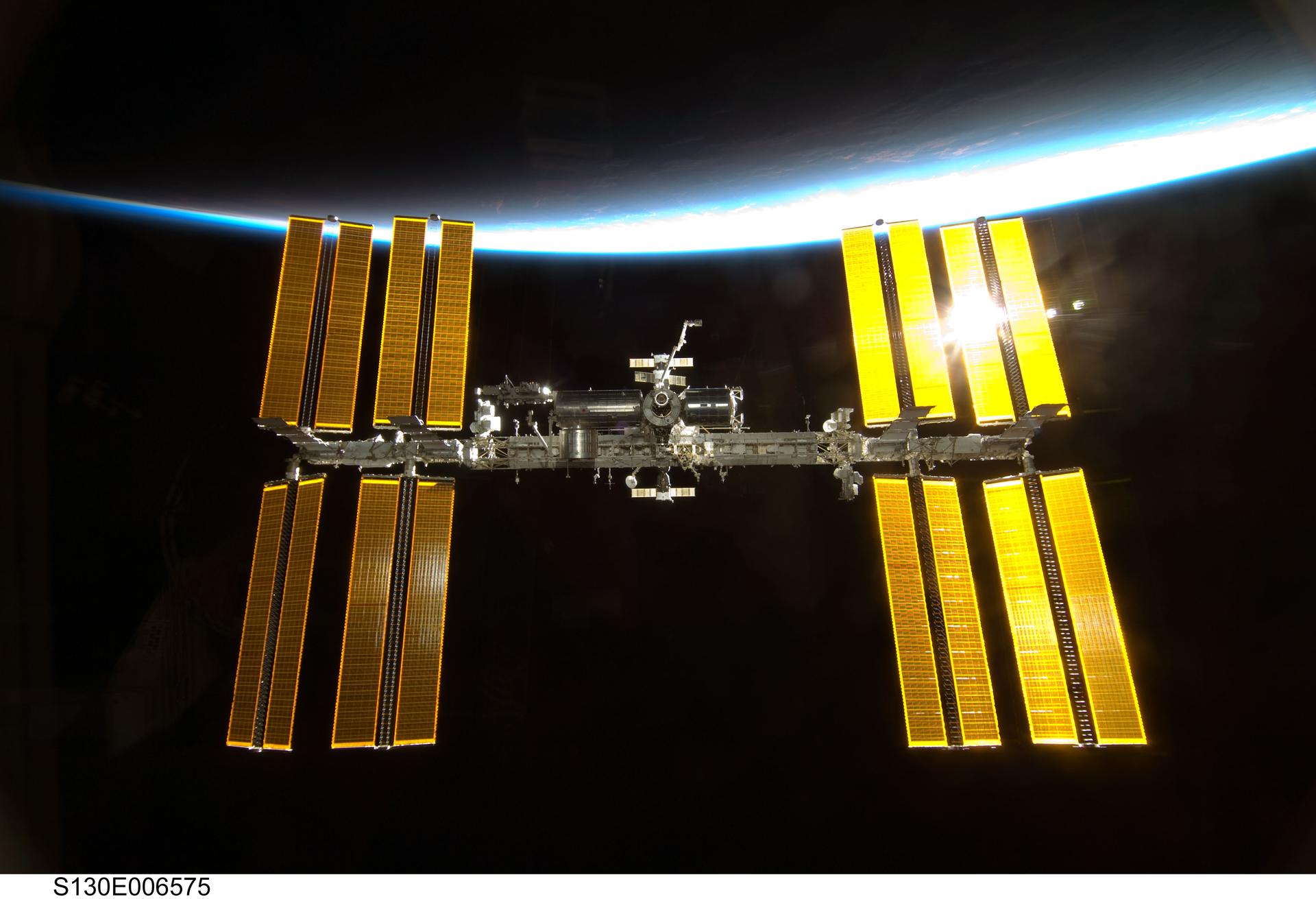 Backdropped by Earth’s horizon and the blackness of space, the International Space Station is featured in this image photographed by an STS-130 crew member as space shuttle Endeavour and the station approach each other during rendezvous and docking activities