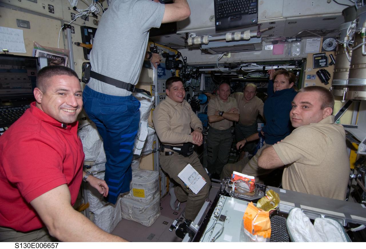 S130-E-006657 (10 Feb. 2010) --- STS-130 and Expedition 22 crew members are pictured shortly after space shuttle Endeavour and the International Space Station docked in space and the hatches were opened. Pictured (clockwise) are NASA astronauts George Zamka (left), STS-130 commander; Stephen Robinson and Robert Behnken, both STS-130 mission specialists; NASA astronaut Jeffrey Williams, Expedition 22 commander; Russian cosmonaut Oleg Kotov, Expedition 22 flight engineer; NASA astronaut Kathryn Hire, STS-130 mission specialist; and Russian cosmonaut Maxim Suraev, Expedition 22 flight engineer.