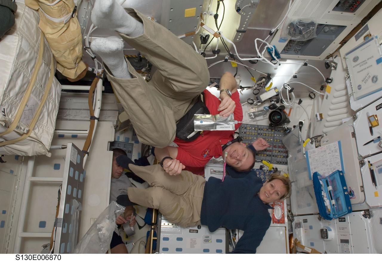 S130-E-006870 (10 Feb. 2010) --- NASA astronauts Terry Virts, STS-130 pilot; and Kathryn Hire, mission specialist, are pictured on the middeck of space shuttle Endeavour while docked with the International Space Station.