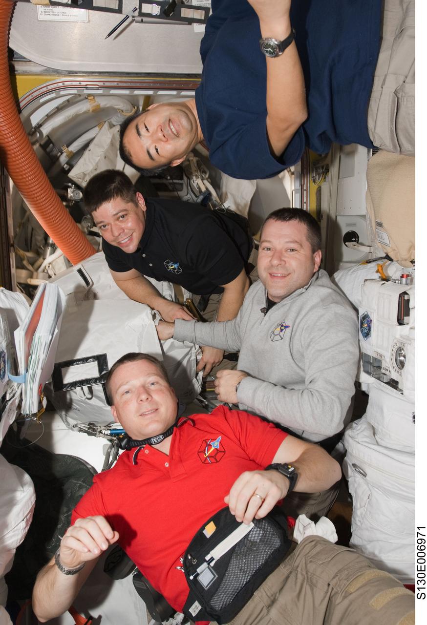 S130-E-006971 (10 Feb. 2010) --- NASA astronauts Terry Virts (bottom), STS-130 pilot; Nicholas Patrick (right) and Robert Behnken, both STS-130 mission specialists; along with Japan Aerospace Exploration Agency (JAXA) astronaut Soichi Noguchi (top), Expedition 22 flight engineer, are pictured in the Quest airlock of the International Space Station while space shuttle Endeavour remains docked with the station.