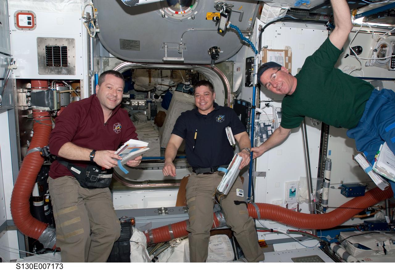 S130-E-007173 (11 Feb. 2010) --- NASA astronauts Nicholas Patrick (left), Robert Behnken and Stephen Robinson, all STS-130 mission specialists, are pictured in the Harmony node of the International Space Station while space shuttle Endeavour remains docked with the station.