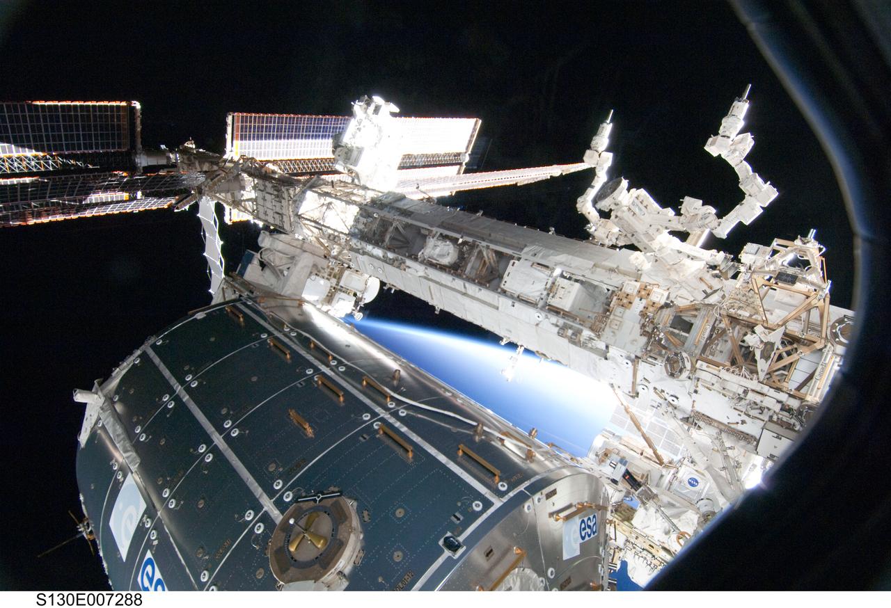 View of Columbus and STBD Truss Segments through Shuttle Window