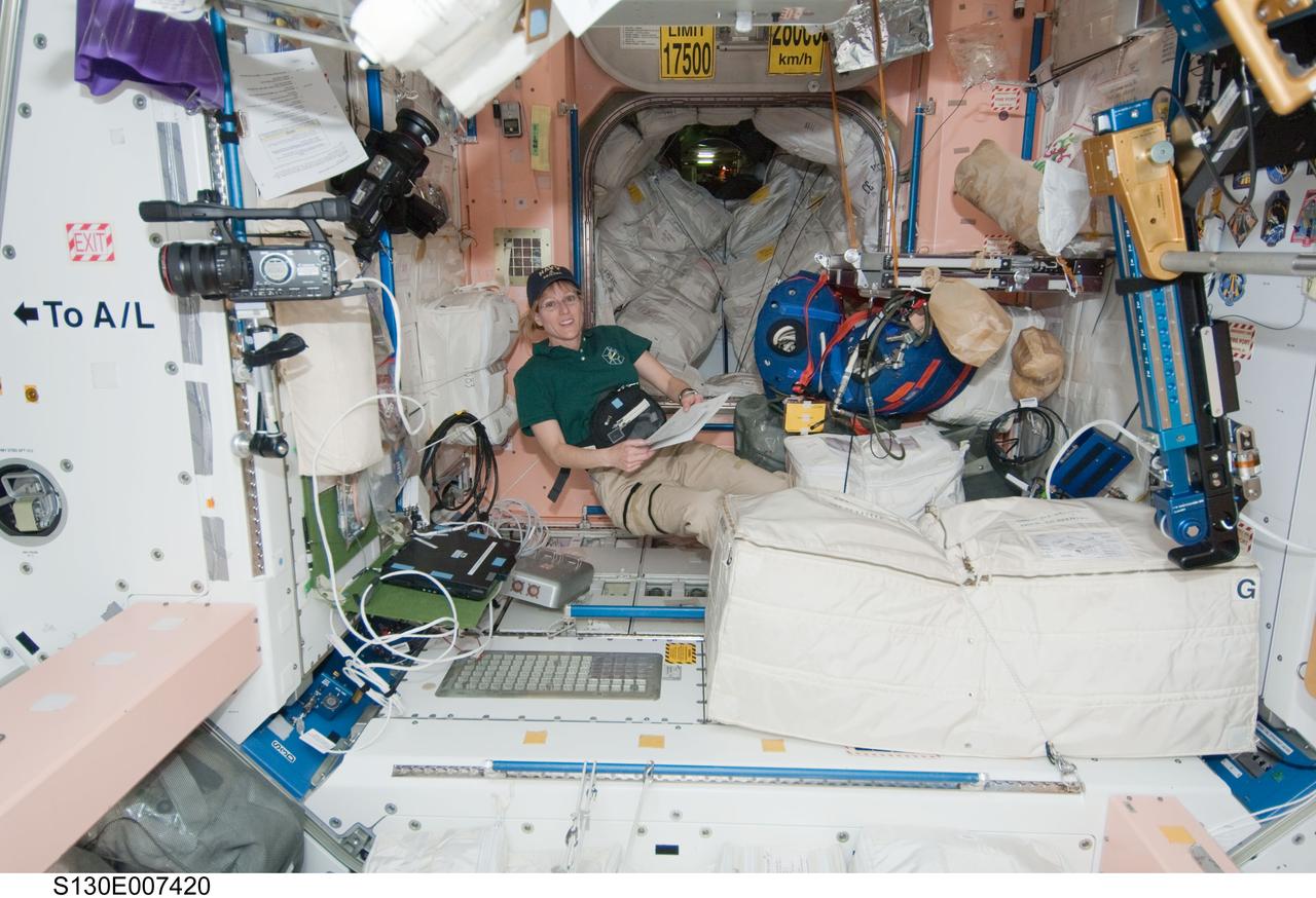 S130-E-007420 (11 Feb. 2010) --- NASA astronaut Kathryn Hire, STS-130 mission specialist, works in the Unity node of the International Space Station while space shuttle Endeavour remains docked with the station.