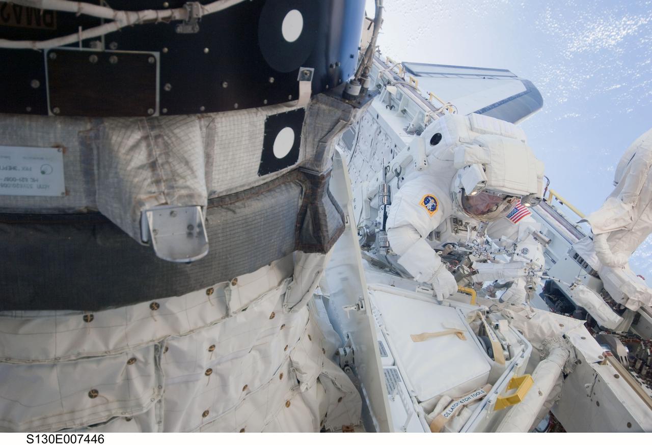 S130-E-007446 (11 Feb. 2010) --- NASA astronaut Nicholas Patrick, STS-130 mission specialist, participates in the mission's first session of extravehicular activity (EVA) as construction and maintenance continue on the International Space Station. During the 6-hour, 32-minute spacewalk, Patrick and astronaut Robert Behnken (out of frame), mission specialist, relocated a temporary platform from the Special Purpose Dexterous Manipulator, or Dextre, to the station’s truss structure and installed two handles on the robot. Once Tranquility was structurally mated to Unity, the spacewalkers connected heater and data cables that will integrate the new module with the rest of the station’s systems. They also pre-positioned insulation blankets and ammonia hoses that will be used to connect Tranquility to the station’s cooling radiators during the mission’s second spacewalk.