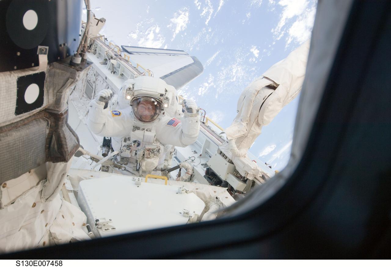 S130-E-007458 (11 Feb. 2010) --- NASA astronaut Nicholas Patrick, STS-130 mission specialist, participates in the mission's first session of extravehicular activity (EVA) as construction and maintenance continue on the International Space Station. During the 6-hour, 32-minute spacewalk, Patrick and astronaut Robert Behnken (out of frame), mission specialist, relocated a temporary platform from the Special Purpose Dexterous Manipulator, or Dextre, to the station’s truss structure and installed two handles on the robot. Once Tranquility was structurally mated to Unity, the spacewalkers connected heater and data cables that will integrate the new module with the rest of the station’s systems. They also pre-positioned insulation blankets and ammonia hoses that will be used to connect Tranquility to the station’s cooling radiators during the mission’s second spacewalk.