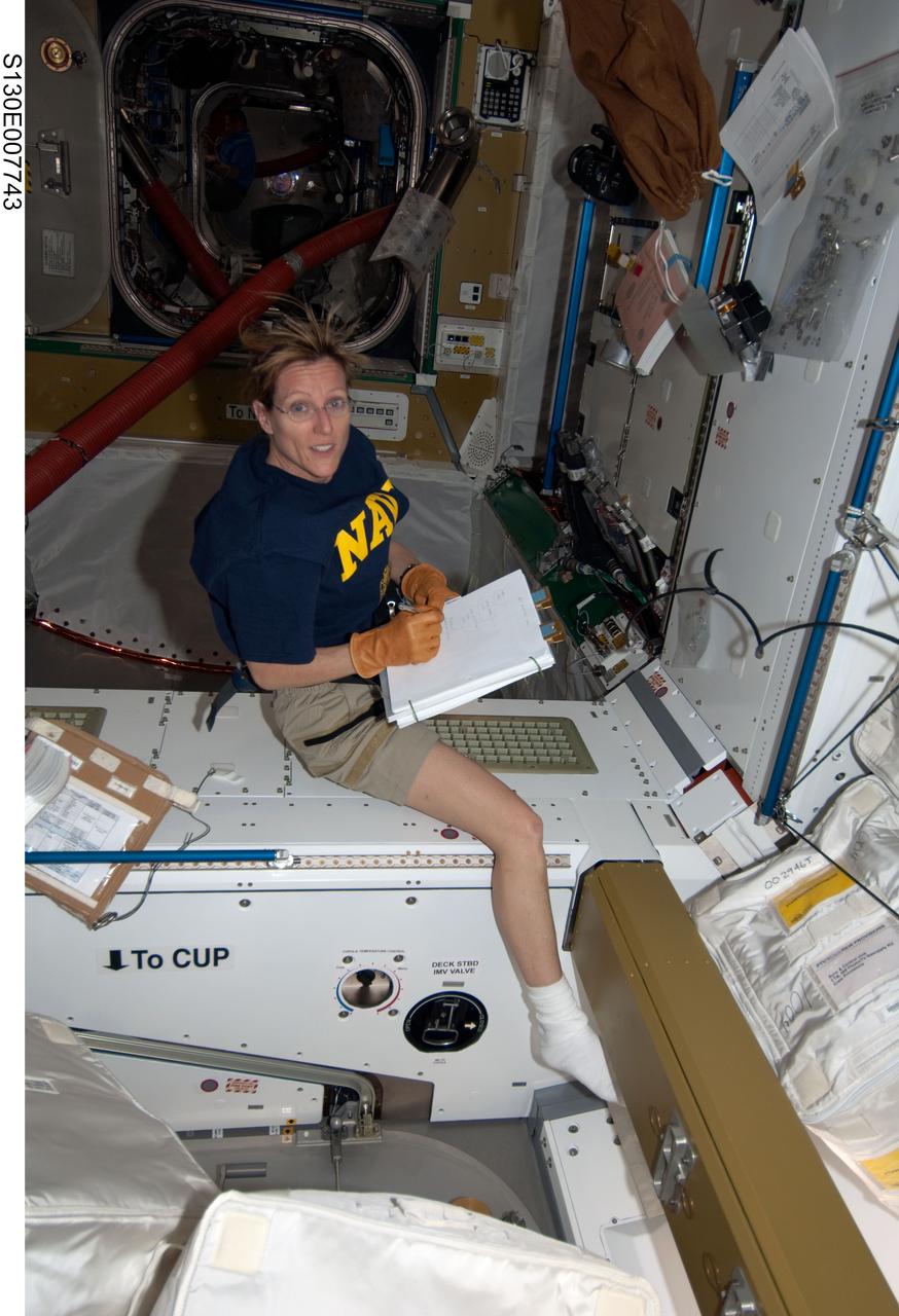 S130-E-007743 (14 Feb. 2010) --- NASA astronaut Kathryn Hire, STS-130 mission specialist, works in the newly-installed Tranquility node of the International Space Station while space shuttle Endeavour remains docked with the station.