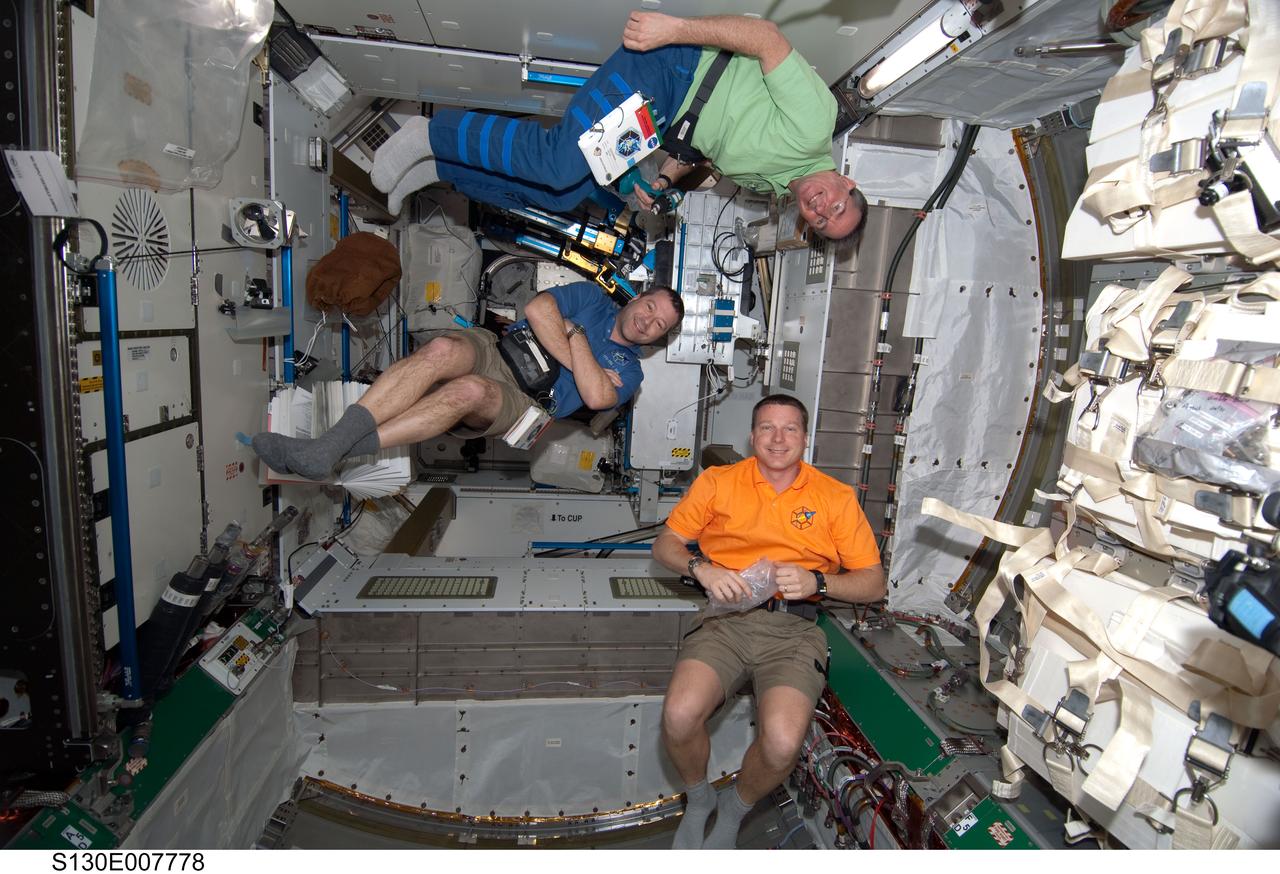 S130-E-007778 (14 Feb. 2010) --- NASA astronauts Terry Virts (right), STS-130 pilot; Nicholas Patrick (left) and Stephen Robinson, both mission specialists, are pictured in the newly-installed Tranquility node of the International Space Station while space shuttle Endeavour remains docked with the station.