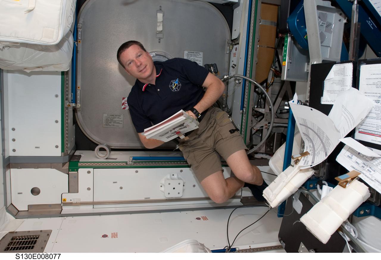 S130-E-008077 (15 Feb. 2010) --- NASA astronaut Terry Virts, STS-130 pilot, is pictured floating freely in the newly-installed Tranquility node of the International Space Station while space shuttle Endeavour remains docked with the station.