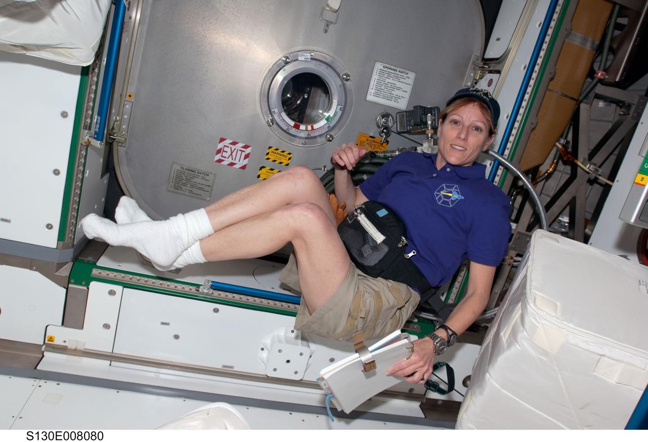 S130-E-008080 (15 Feb. 2010) --- NASA astronaut Kathryn Hire, STS-130 mission specialist, is pictured floating freely in the newly-installed Tranquility node of the International Space Station while space shuttle Endeavour remains docked with the station.